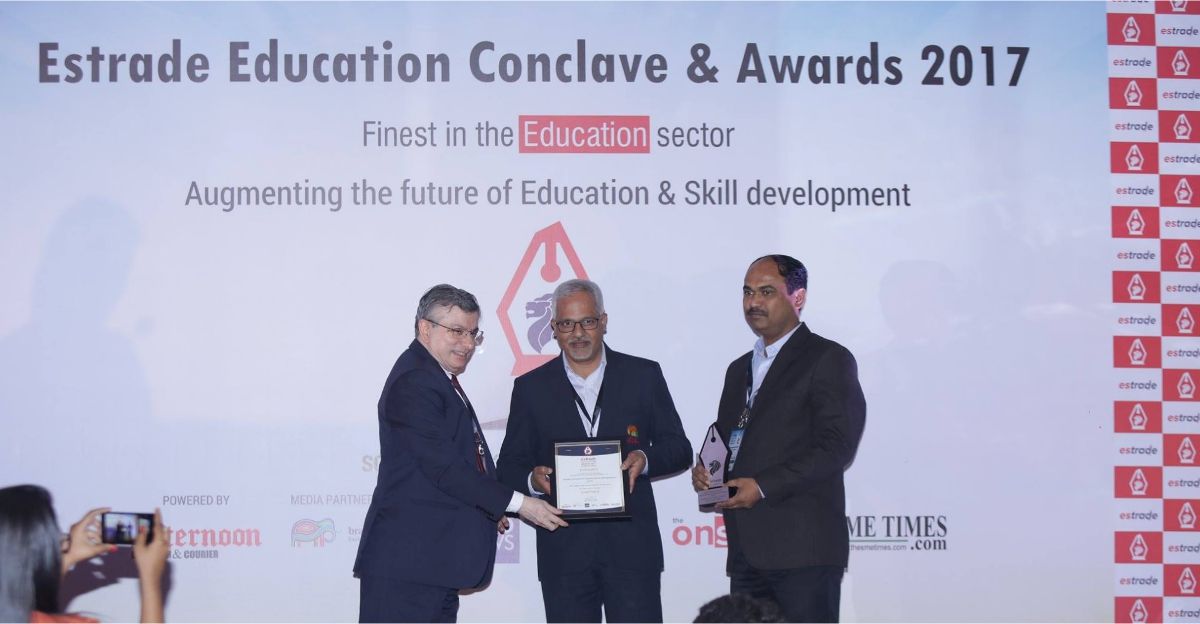 Dr. Milind Ray, Principal & Dipak Kadam, Professor - Sandip Institute of Engineering & Management receiving award from Mr. Robin Banerjee, CEO - Caprihans