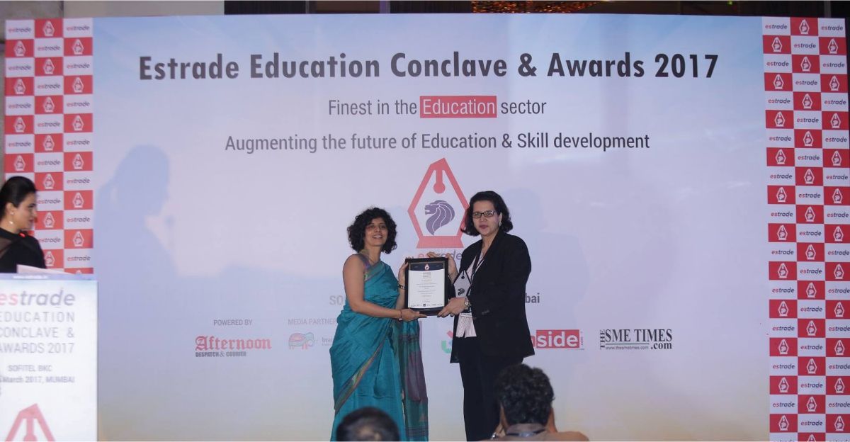 Dr. Zuleika Homavazir, HOD - Wilson College receiving Female Educationist of the Year award from Ms. Swati Lodha